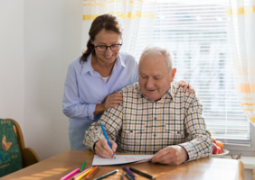 Occupational therapist with client at their home