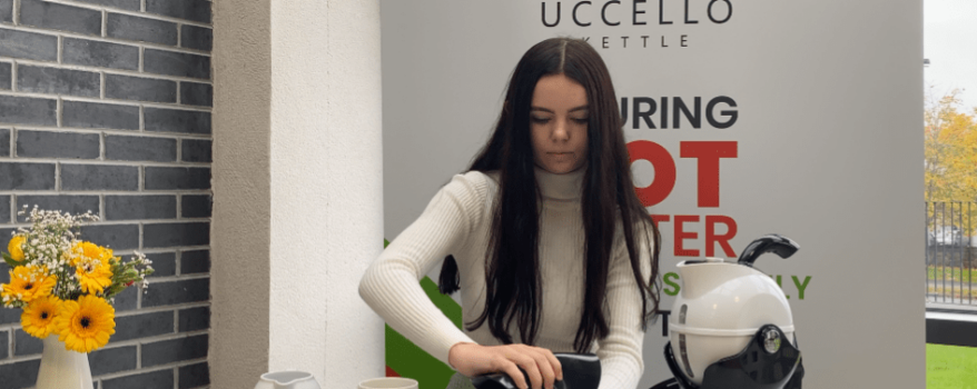 Woman using the Uccello Grip Mat in the ktichen to open a jar