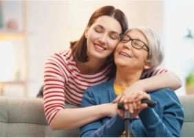 Adult daughter hugging her elderly mother (Photo Cred: Canva)
