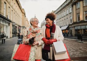 Middle aged women shopping the high street this Christmas